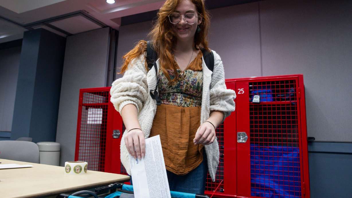 Eliza Taylor, of Provo, casts her vote at the voting center in the Utah County Health and Justice Building in Provo on Tuesday, Nov. 4, 2025.