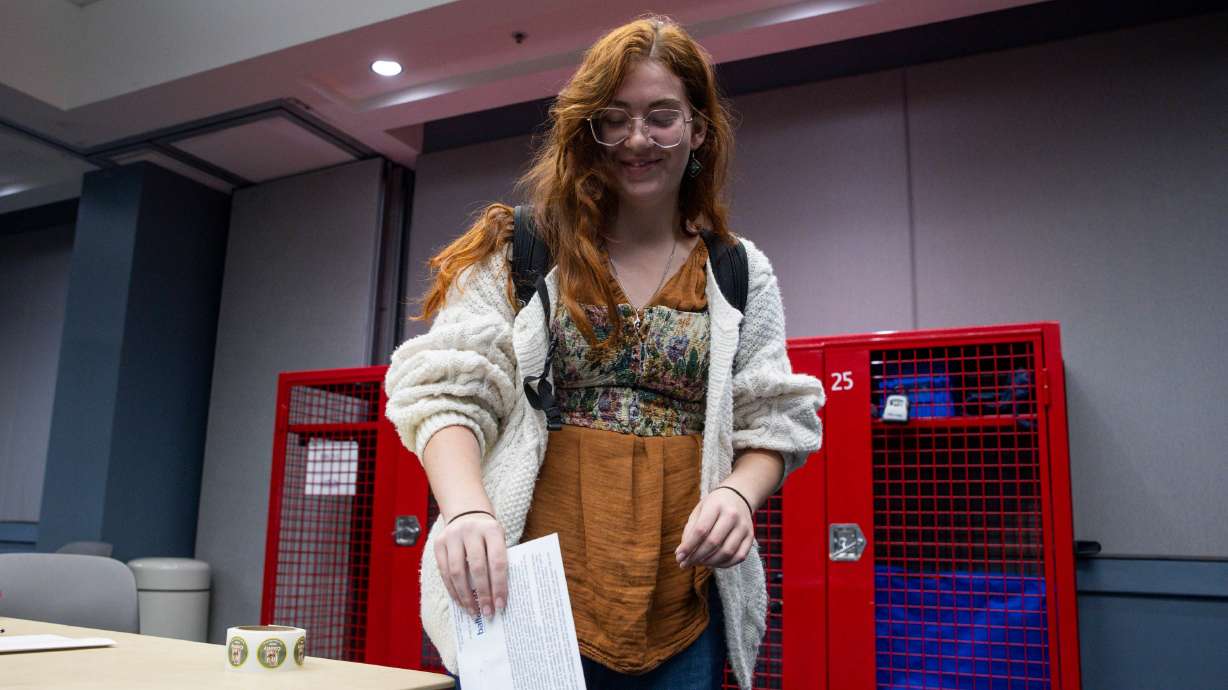 Eliza Taylor, of Provo, casts her vote at the voting center in the Utah County Health and Justice Building in Provo on Tuesday, Nov. 4, 2025.