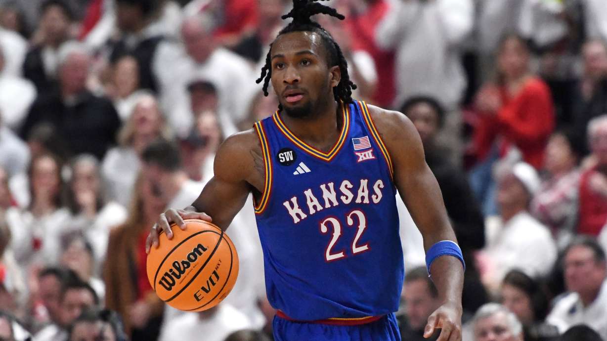 Kansas guard Darryn Peterson dribbles during the second half of an NCAA college basketball game against Texas Tech, Monday, Feb. 2, 2026, in Lubbock, Texas.