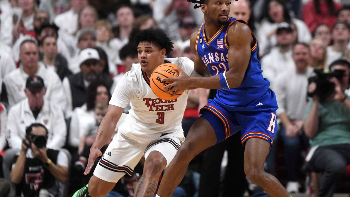 Texas Tech forward Lejuan Watts (3) attempts to guard Kansas guard Darryn Peterson (22) during the first half of an NCAA college basketball game, Monday, Feb. 2, 2026, in Lubbock, Texas.