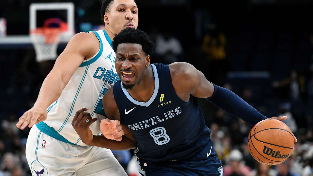 Memphis Grizzlies forward Jaren Jackson Jr. (8) handles the ball against Charlotte Hornets forward Grant Williams (2) in the second half of an NBA basketball game Wednesday, Jan. 28, 2026, in Memphis, Tenn.