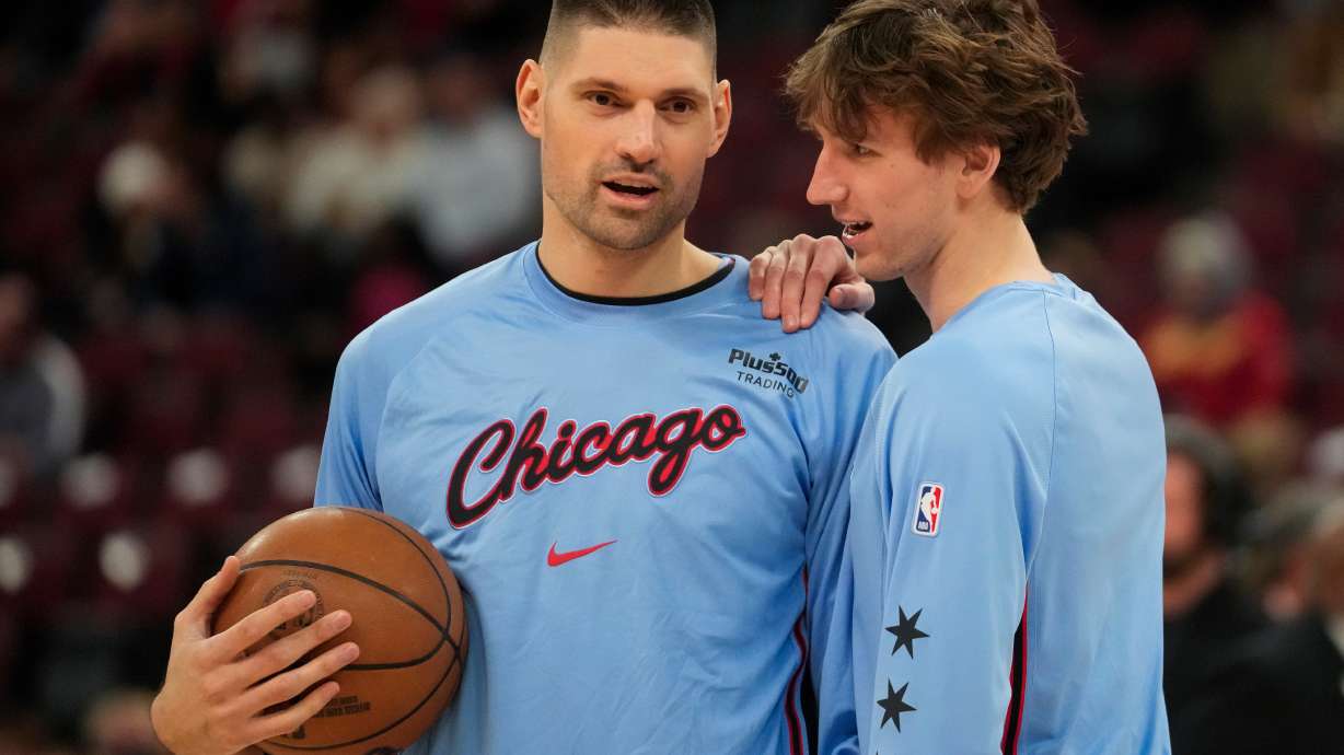 Chicago Bulls center Nikola Vucevic, left, and forward Matas Buzelis warm up before an NBA basketball game against the Miami Heat, Thursday, Jan. 29, 2026, in Chicago.