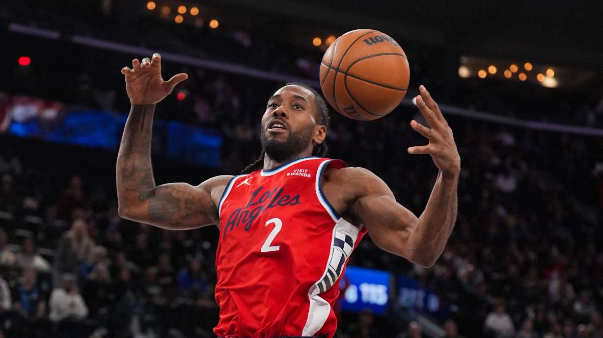 Los Angeles Clippers forward Kawhi Leonard descends after making a dunk during the second half of an NBA basketball game against the Philadelphia 76ers Monday, Feb. 2, 2026, in Inglewood, Calif.