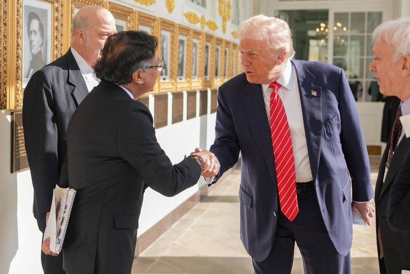 President Donald Trump and his Colombian counterpart Gustavo Petro shake hands at the White House, in Washington, Tuesday. The two had a cordial private meeting after an up-and-down relationship recently.