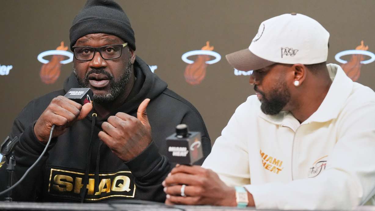 Former Miami Heat players Dwyane Wade, right and Shaquille O'Neal talk about their experience winning the NBA finals 20 years ago during a news conference Tuesday, Feb. 3, 2026, in Miami.
