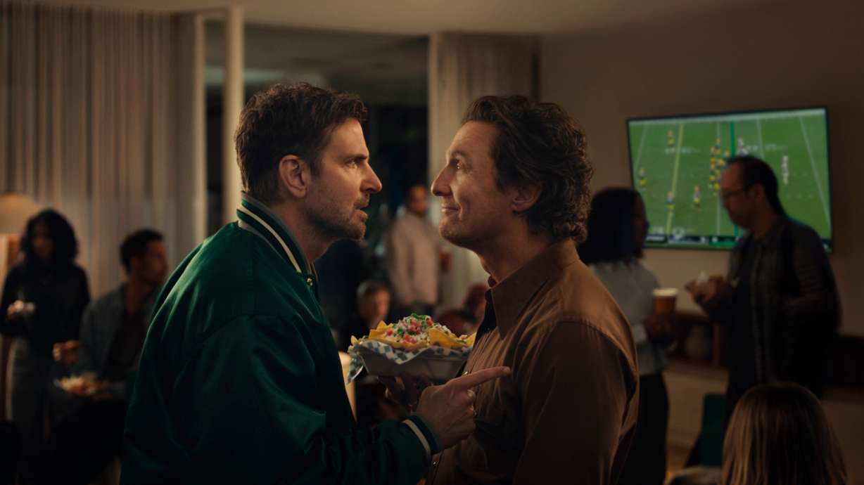 This undated image provided by Uber Eats shows Bradley Cooper, left, and Matthew McConaughey in a scene from the Uber Eats 2026 Super Bowl NFL football spot.