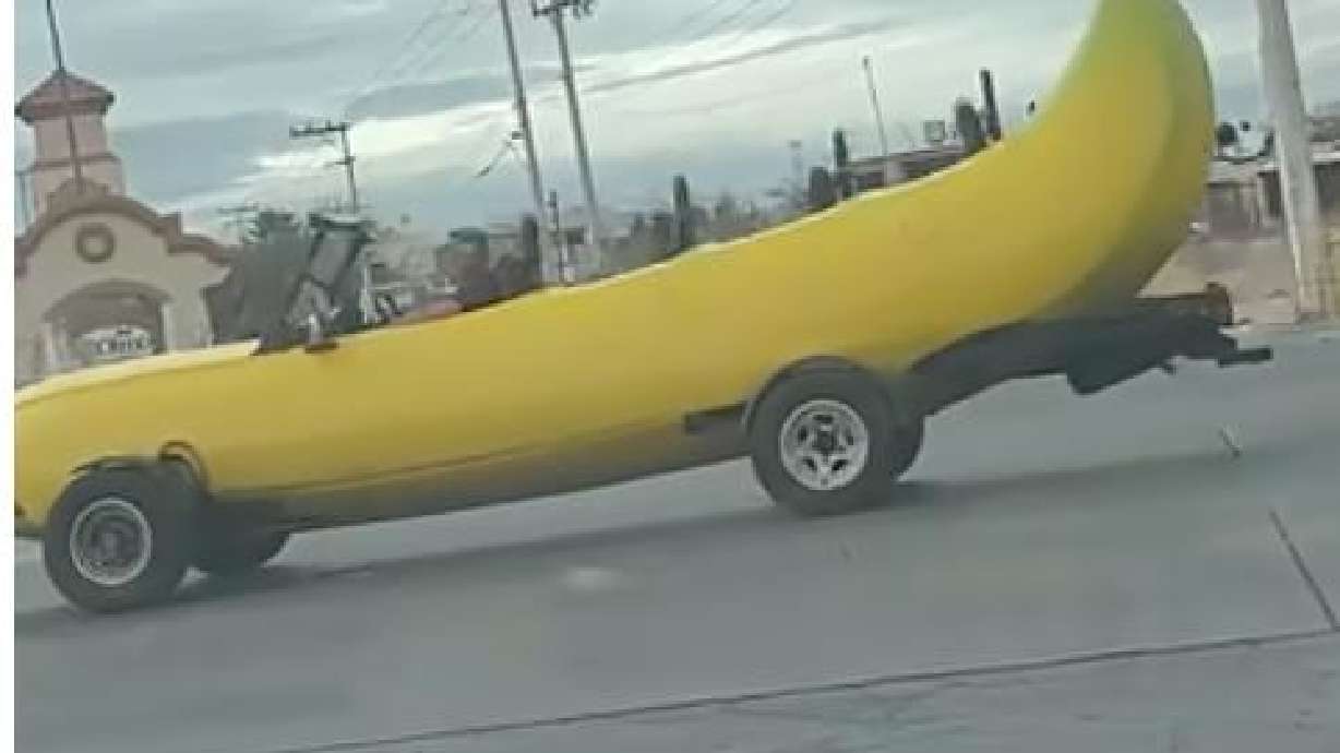A banana-shaped car drives through the intersection at Mount Everest and Nogales, in Chihuahua, Chihuahuá, Mexico, on Jan. 7.