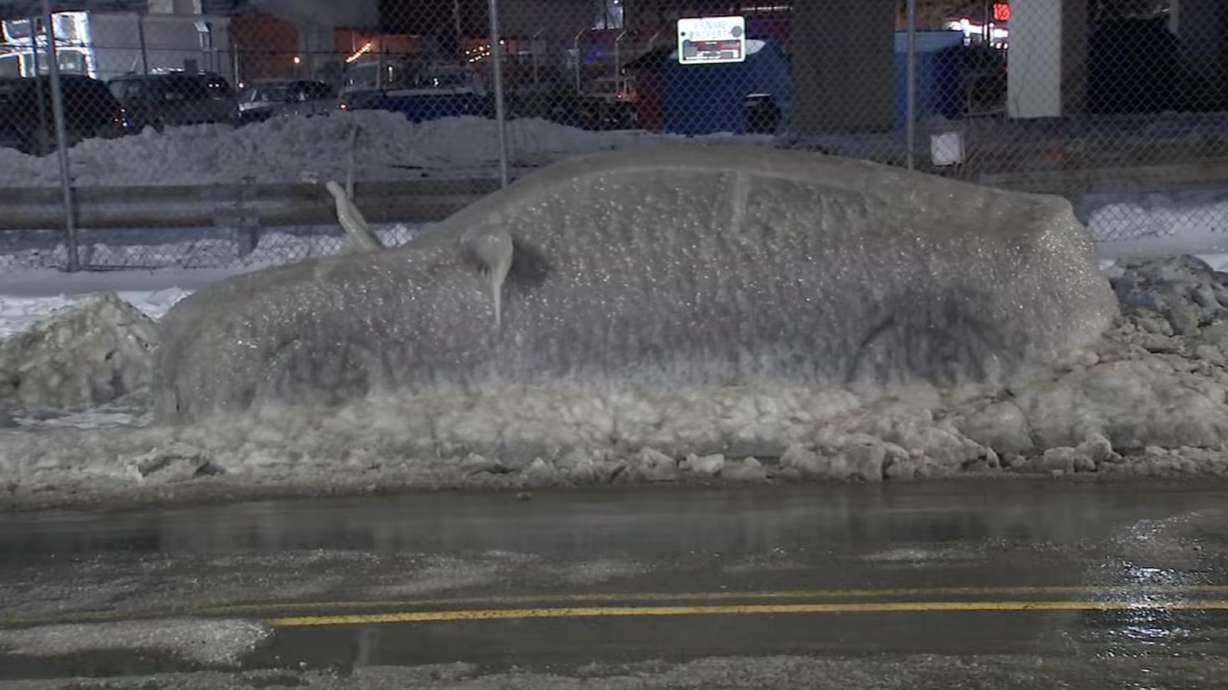 A vehicle is shrouded in ice after storms and cold temperatures in the 1000 block of North Front Street in Fishtown, Philadelphia, Feb. 2.