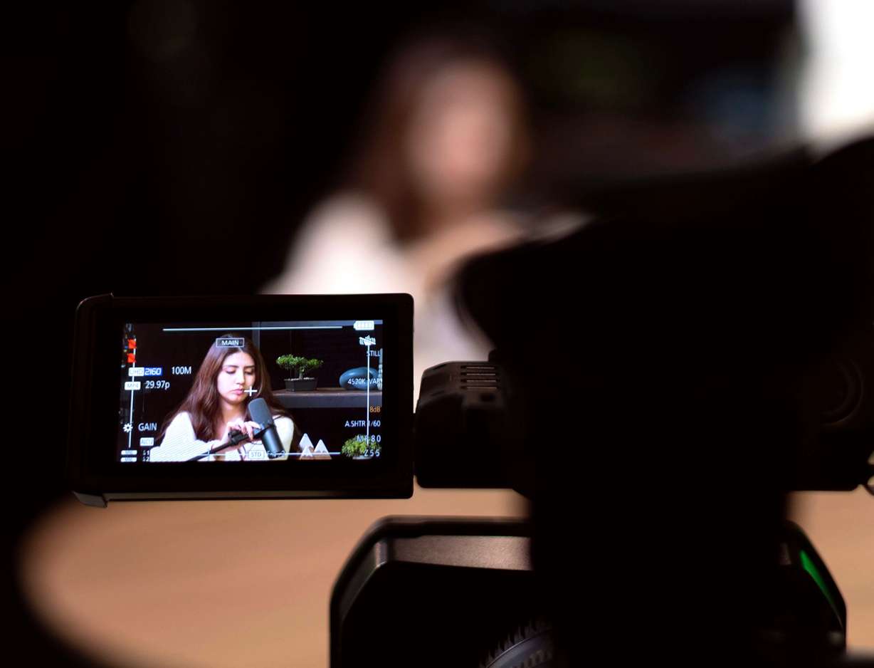 Communications student Maribel Camacho sets up a microphone in Studio E in preparation for recording a podcast with the president of the college at Ensign College in Salt Lake City on Wednesday. President Bruce Kusch called the accelerated programs "a great solution" for all students.