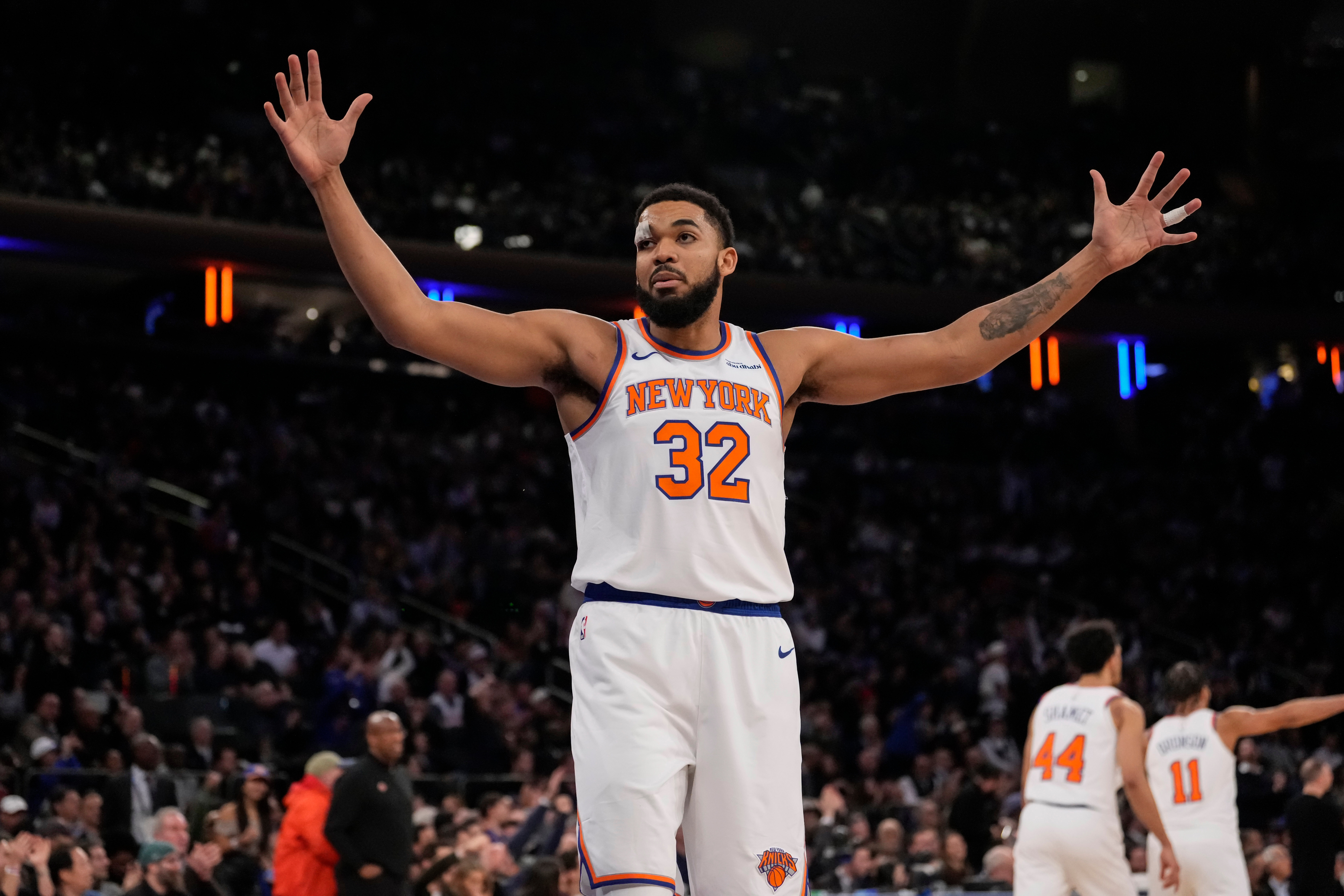 New York Knicks center Karl-Anthony Towns (32) reacts during the first half of an NBA basketball game against the Denver Nuggets, Wednesday, Feb. 4, 2026, in New York. 