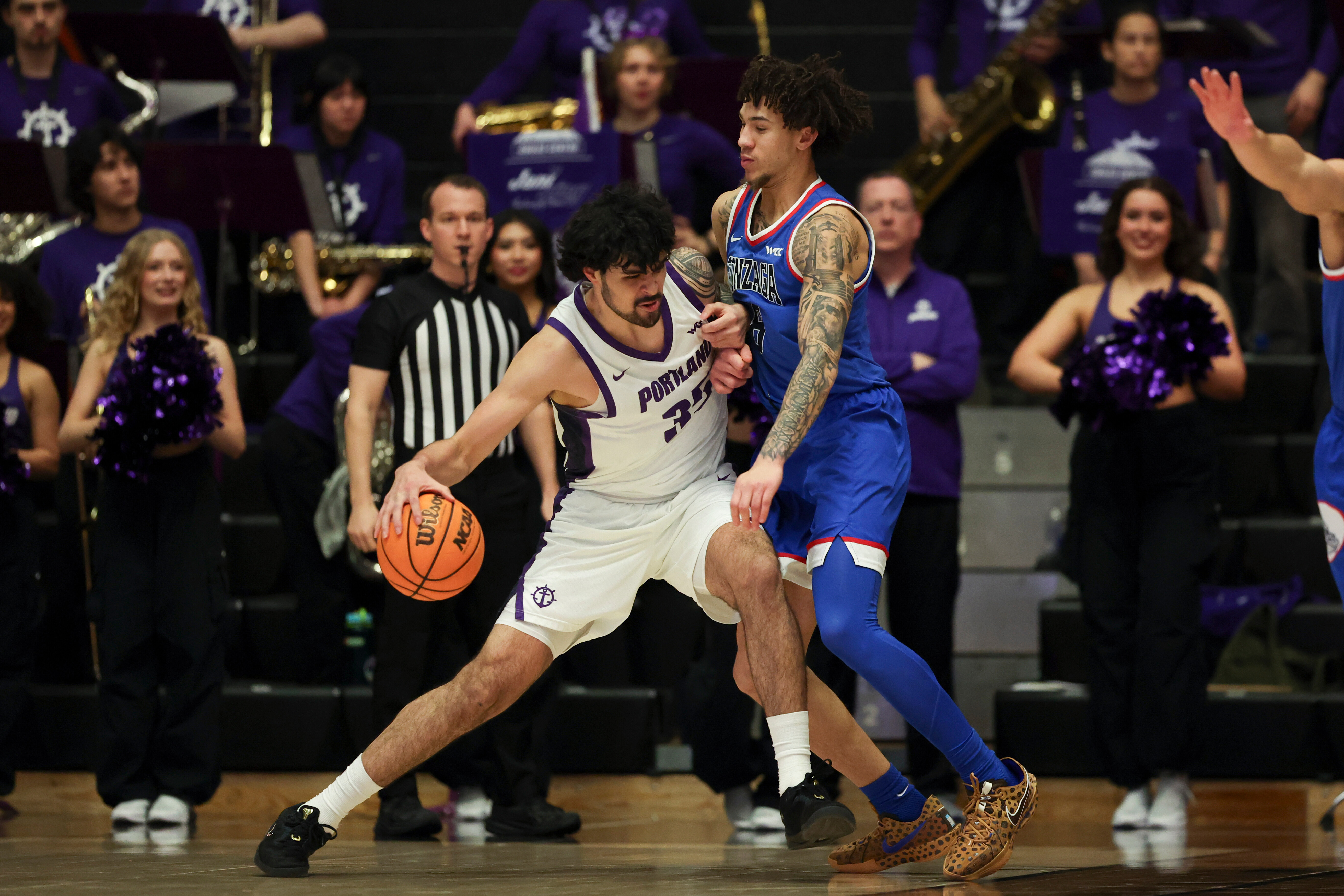 Portland forward Cameron Williams (35) drives to the basket as Gonzaga guard Jalen Warley (8) defends during the first half of an NCAA college basketball game in Portland, Ore., Wednesday, Feb. 4, 2026. 