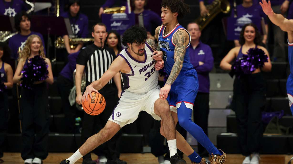 Portland forward Cameron Williams (35) drives to the basket as Gonzaga guard Jalen Warley (8) defends during the first half of an NCAA college basketball game in Portland, Ore., Wednesday, Feb. 4, 2026.