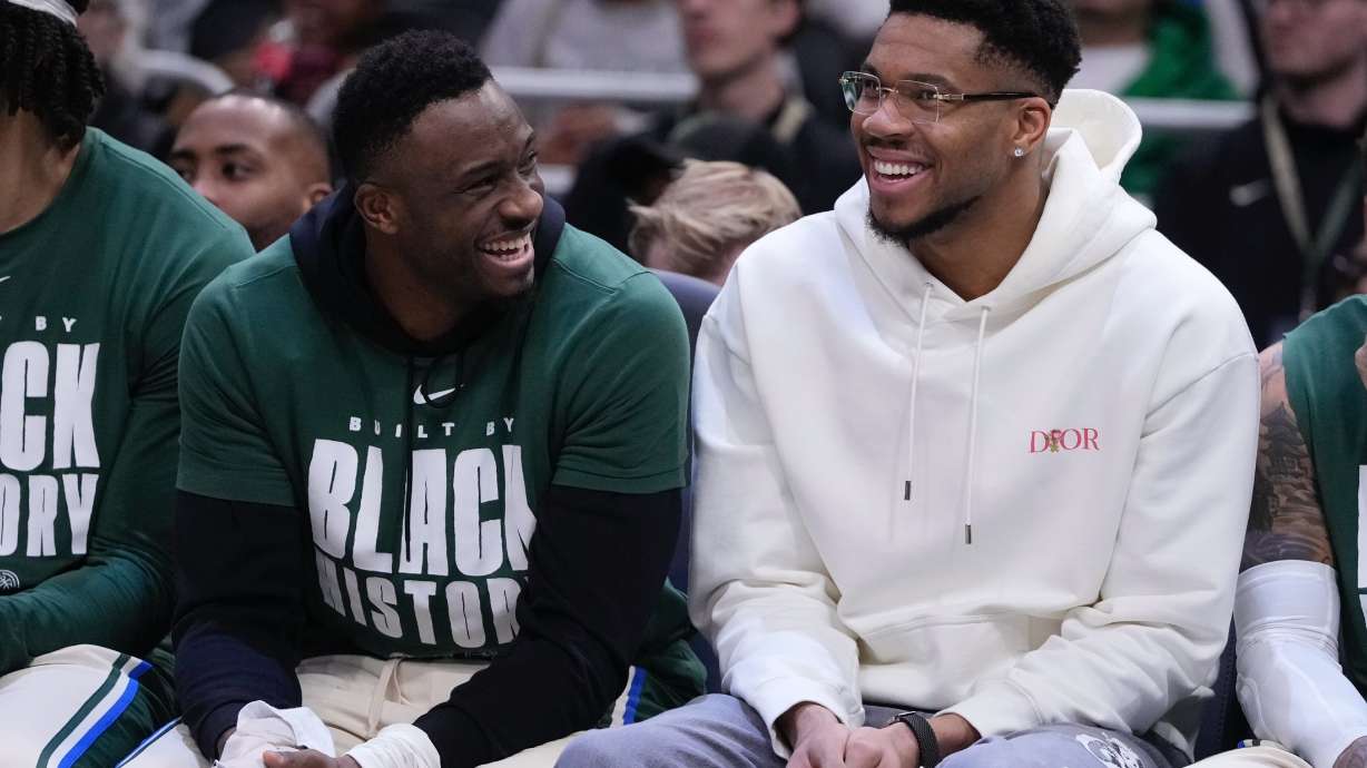 Milwaukee Bucks' Giannis Antetokounmpo smiles on the bench with Thanasis Antetokounmpo during the first half of an NBA basketball game Wednesday, Feb. 4, 2026, in Milwaukee.