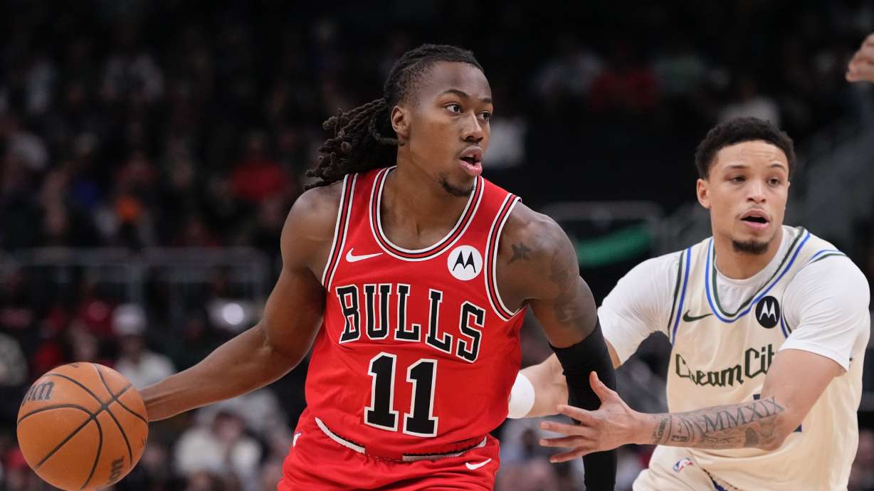 Chicago Bulls' Ayo Dosunmu gets past Milwaukee Bucks' Amir Coffey during the first half of an NBA basketball game Tuesday, Feb. 3, 2026, in Milwaukee.