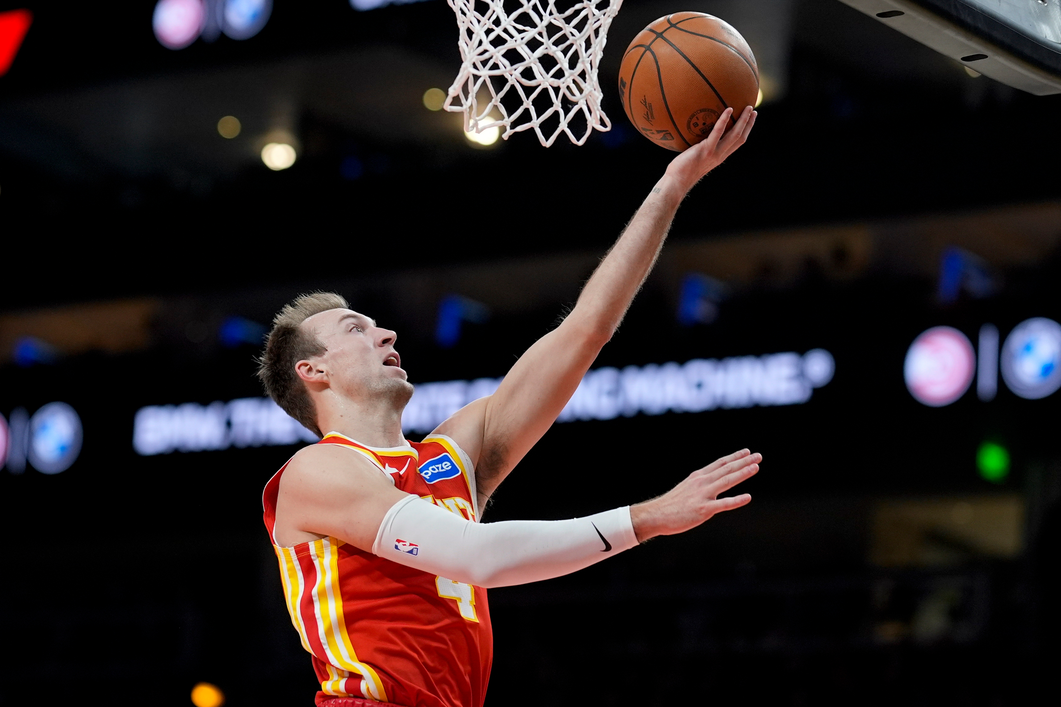 Atlanta Hawks guard Luke Kennard (4) shoots against the Indiana Pacers during the second half of an NBA basketball game, Monday, Jan. 26, 2026, in Atlanta. 