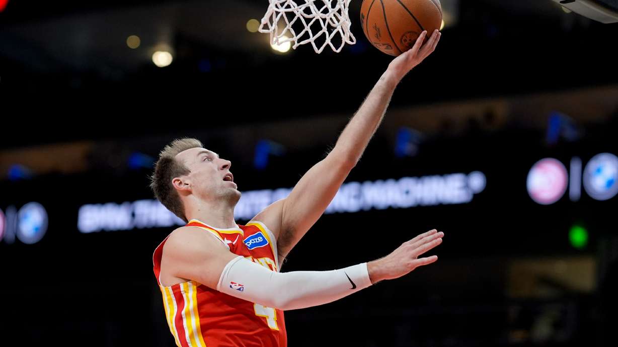 Atlanta Hawks guard Luke Kennard (4) shoots against the Indiana Pacers during the second half of an NBA basketball game, Monday, Jan. 26, 2026, in Atlanta.