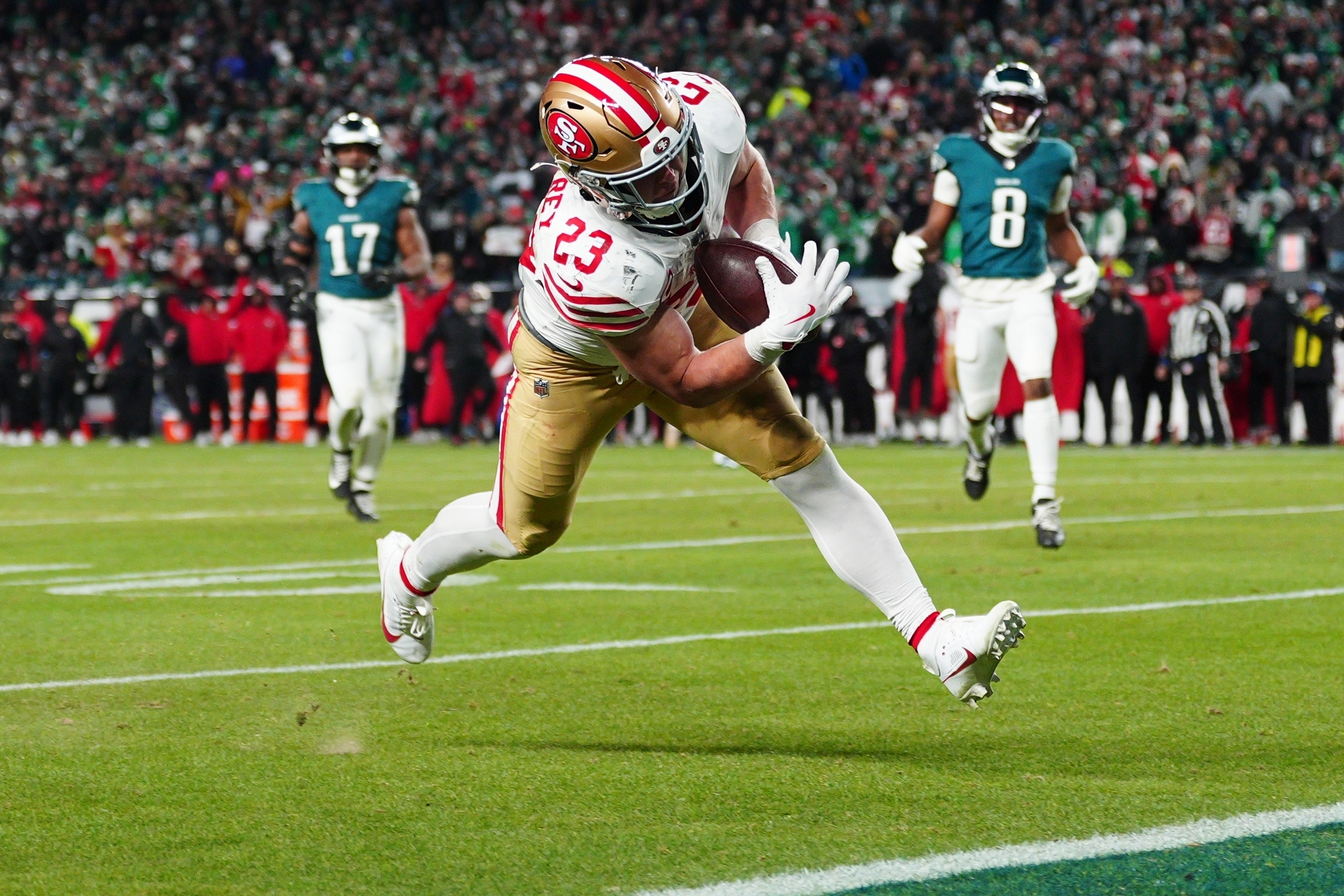 San Francisco 49ers running back Christian McCaffrey scores a touchdown during the second half of an NFL wild-card playoff football game against the Philadelphia Eagles on Sunday, Jan. 11, 2026, in Philadelphia. 
