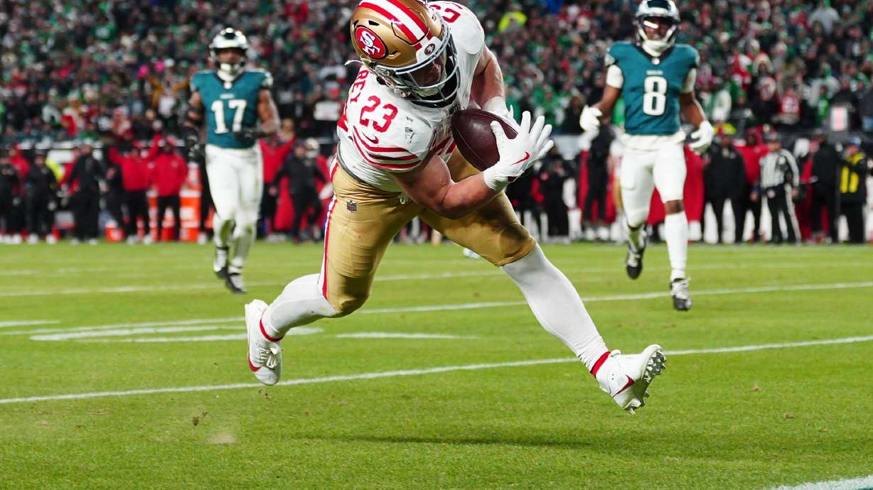 San Francisco 49ers running back Christian McCaffrey scores a touchdown during the second half of an NFL wild-card playoff football game against the Philadelphia Eagles on Sunday, Jan. 11, 2026, in Philadelphia.
