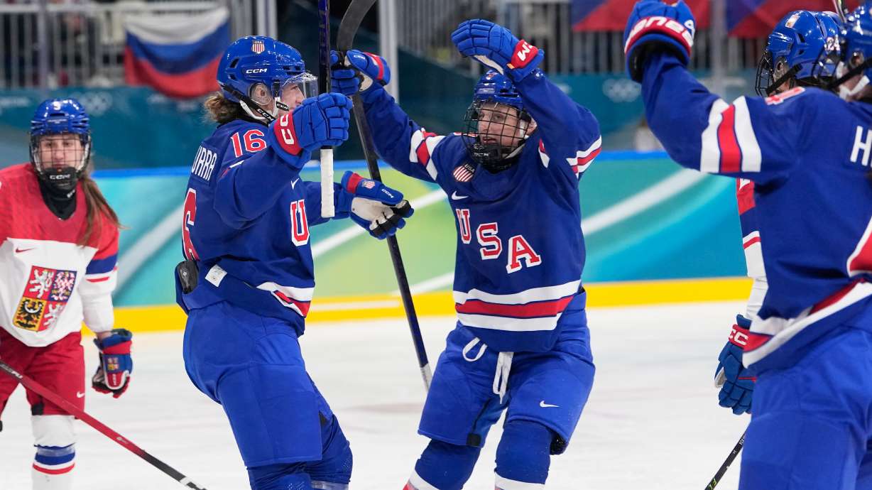 United States' Hayley Scamurra, left, celebrates with teammates after scoring her sides fifth goal during a preliminary round match of women's ice hockey between United States and Czechia at the 2026 Winter Olympics, in Milan, Italy, Thursday, Feb. 5, 2026.