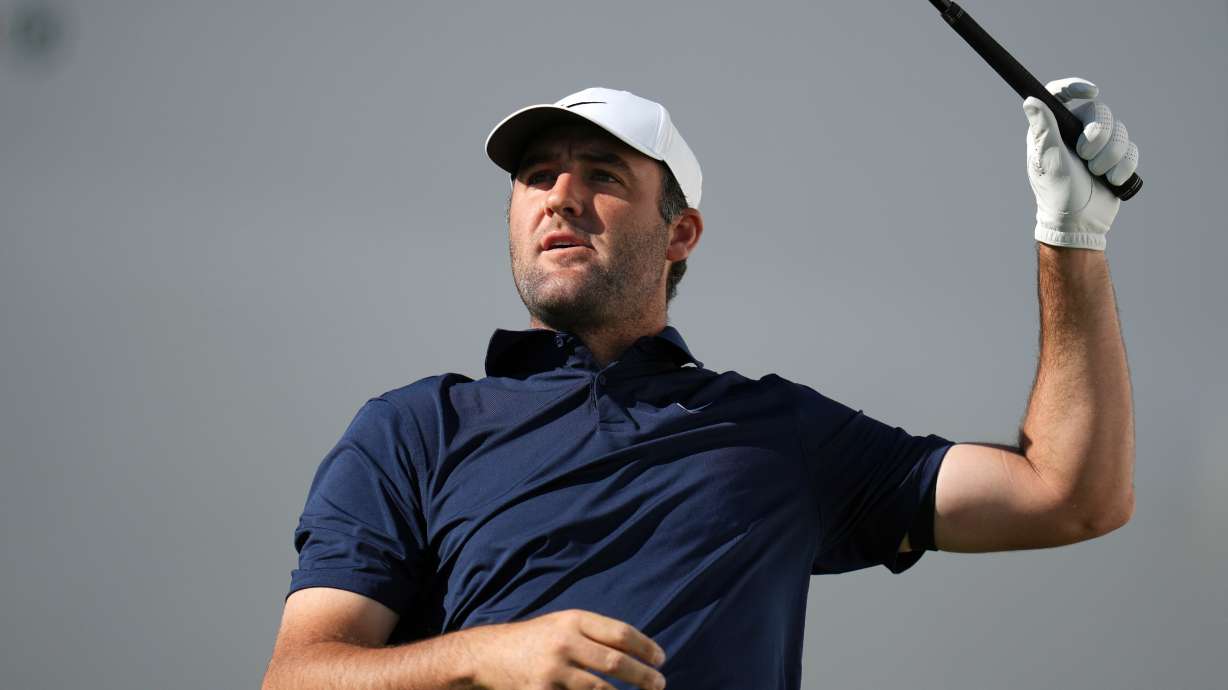 Scottie Scheffler watches his tee shot at the 17th hole during the first round of the Phoenix Open golf tournament at the TPC Scottsdale Stadium Course Thursday, Feb. 5, 2026, in Scottsdale, Ariz.