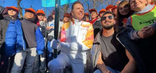 Utah 2034 Chairman Fraser Bullock runs Olympic torch in Milan, inspires thousands of students