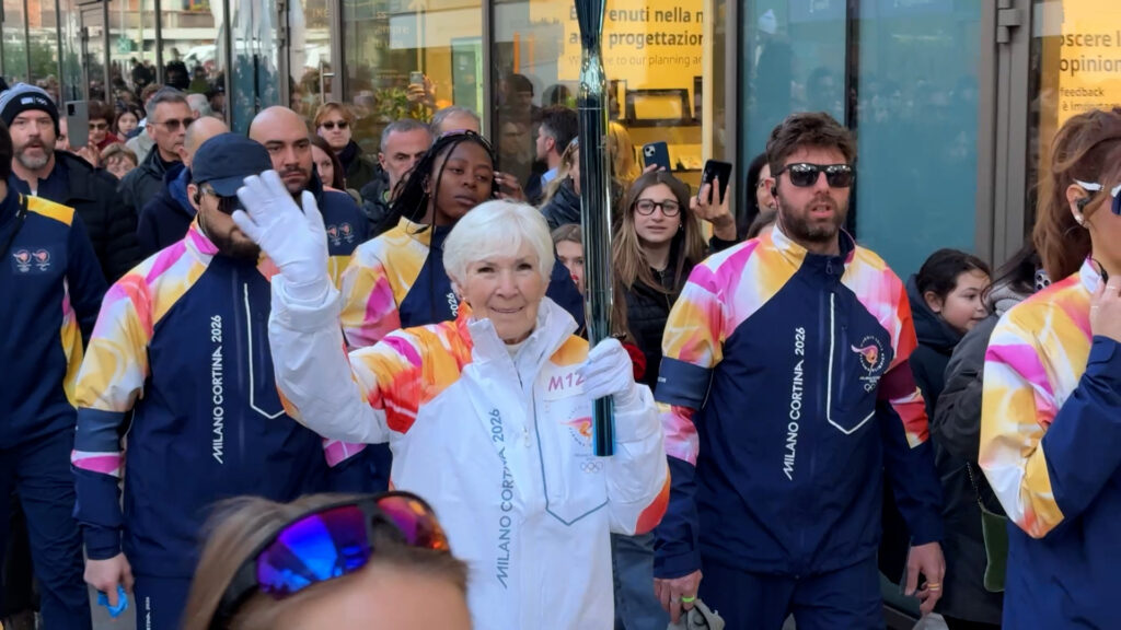 Gail Miller carries Olympic torch through Milan ahead of 2026 Games