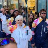 Gail Miller carries Olympic torch through Milan ahead of 2026 Games