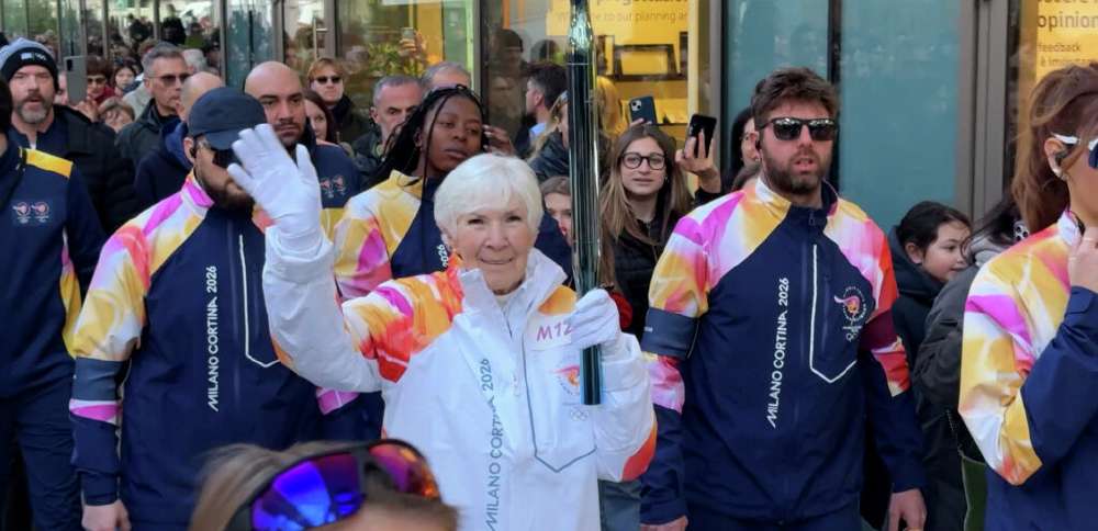 Gail Miller carries Olympic torch through Milan ahead of 2026 Games