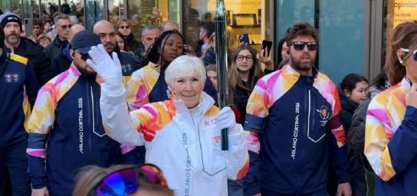 Gail Miller carries Olympic torch through Milan ahead of 2026 Games