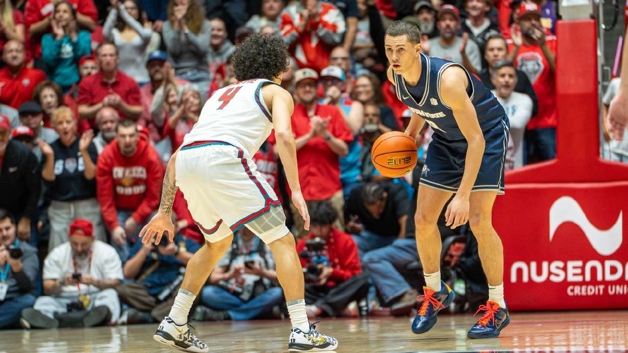 Utah State's Drake Allen looks to drive against New Mexico during a Mountain West men's basketball game, Wednesday, Feb. 4, 2026 in Albuquerque, New Mexico.