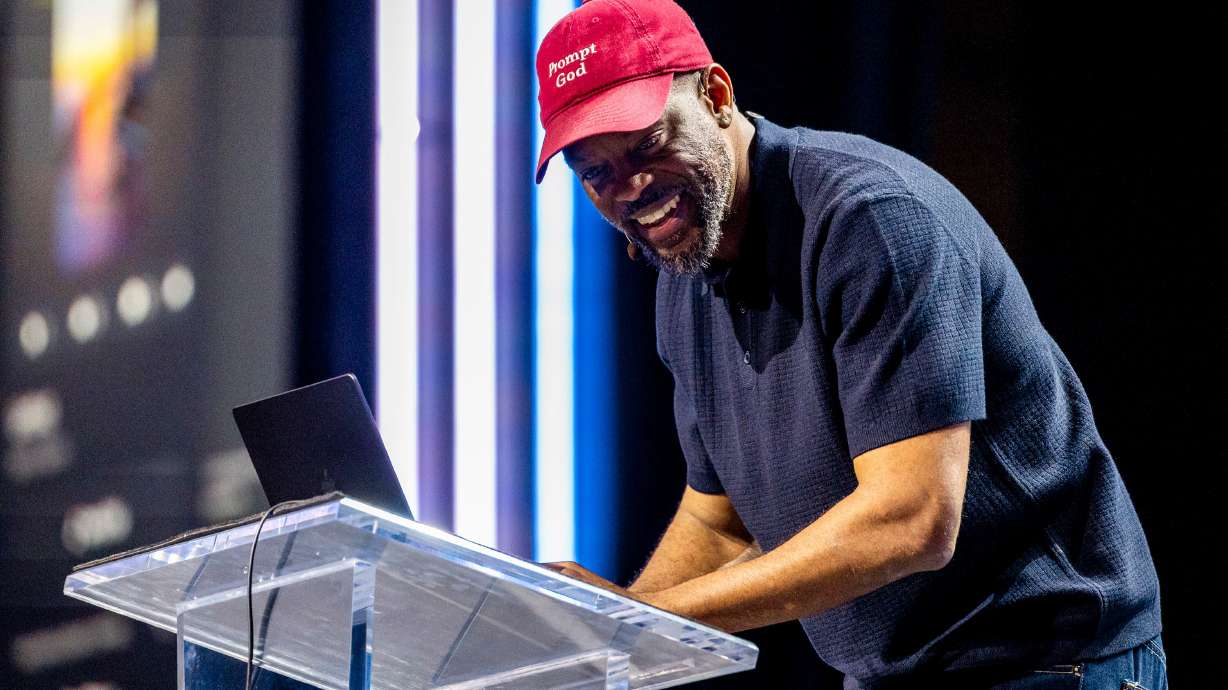 Willonius Hatcher, an AI storyteller known as King Willonius, gives the audience a live demonstration of creating an AI-generated song during the Silicon Slopes Summit at the Salt Palace Convention Center in Salt Lake City on Thursday.