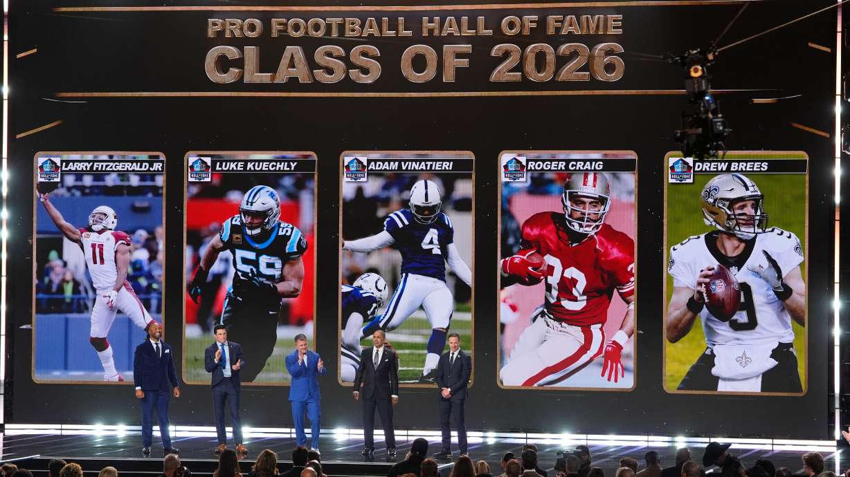 Pro Football Hall of Fame Class of 2026 Larry Fitzgerald, Luke Kuechly, kicker Adam Vinatieri, Roger Craig and Drew Brees stand of stage during the NFL Honors award show, Thursday, Feb. 5, 2026, in San Francisco.