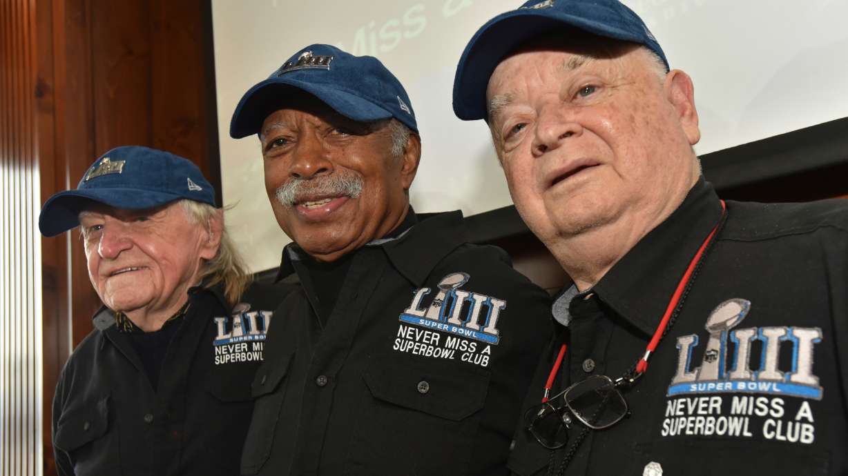 FILE — Members of the Never Miss a Super Bowl Club, from the left, Tom Henschel, Gregory Eaton, and Don Crisman pose for a group photograph during a welcome luncheon, in Atlanta, Feb. 1, 2019.