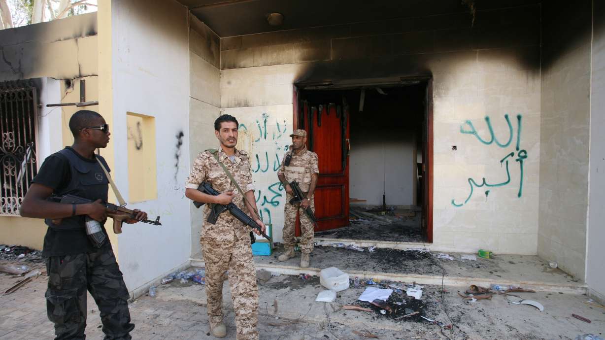 Libyan military guards check one of the U.S. Consulate's burnt-out buildings, Sept. 14, 2012, after the deadly attack on the Consulate on Sept. 11, in Benghazi, Libya. An accused militant involved in the attack was taken into custody on Friday.