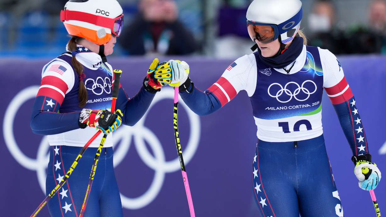 United States' Lindsey Vonn, right, and Breezy Johnson at the finish area during an alpine ski, women's downhill official training, at the 2026 Winter Olympics, in Cortina d'Ampezzo, Italy, Friday, Feb. 6, 2026.