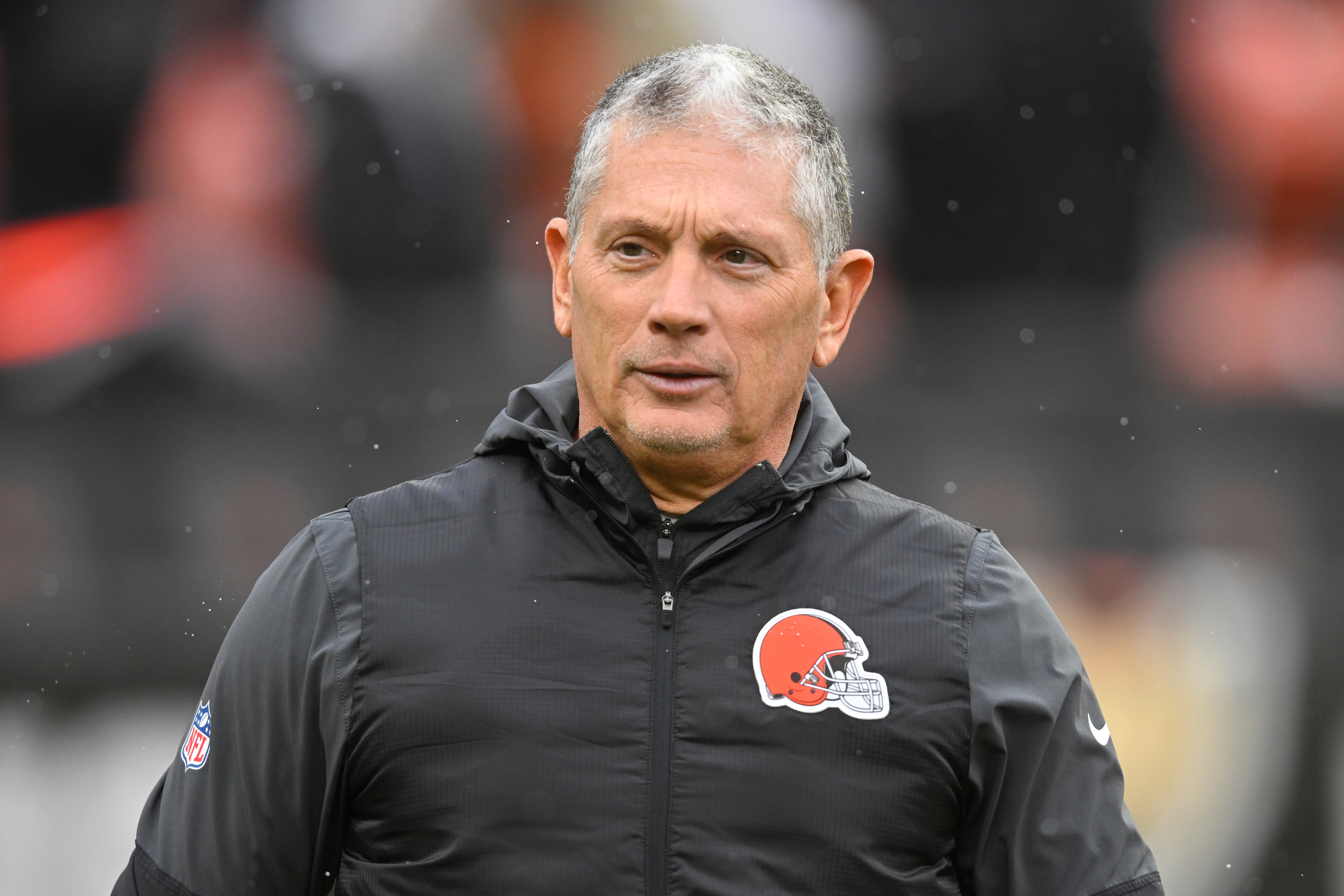 FILE - Cleveland Browns defensive coordinator Jim Schwartz walks on the field before an NFL football game against the Tennessee Titans in Cleveland, Dec. 7, 2025. 