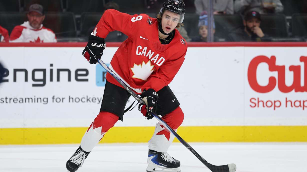 FILE - Canada forward Gavin McKenna (9) controls the puck during the second period of an IIHF World Junior Hockey Championship bronze medal game against Finland, Jan. 5, 2026, in St. Paul, Minn.