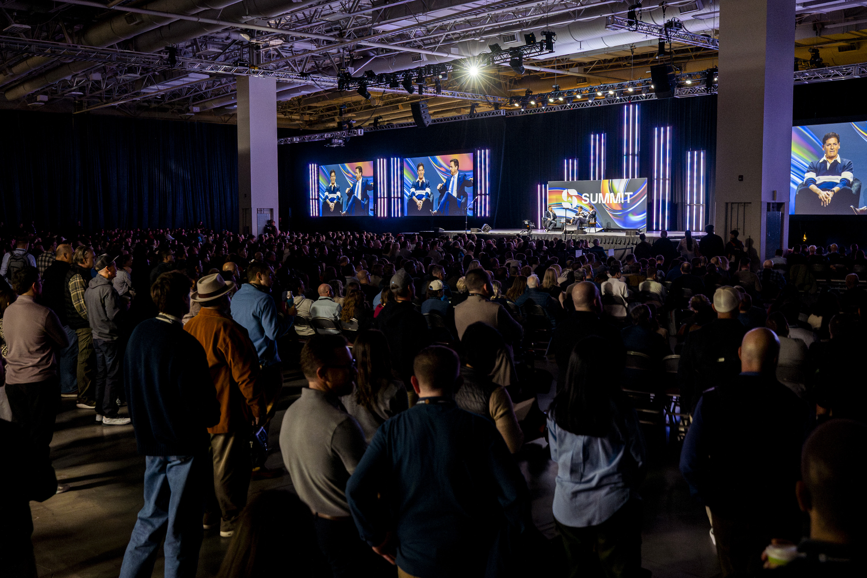Attendees listen to a discussion between Mark Cuban, businessman and co-founder of Cost Plus Drugs, and Chris Klomp, director of the Center for Medicare within the U.S. Department of Health and Human Services, during the Silicon Slopes Summit in Salt Lake City on Friday.