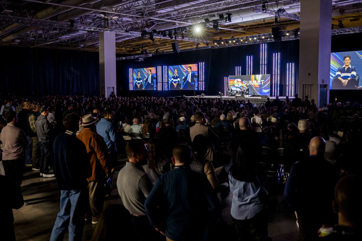 Attendees listen to a discussion between Mark Cuban, businessman and co-founder of Cost Plus Drugs, and Chris Klomp, director of the Center for Medicare within the U.S. Department of Health and Human Services, during the Silicon Slopes Summit in Salt Lake City on Friday.
