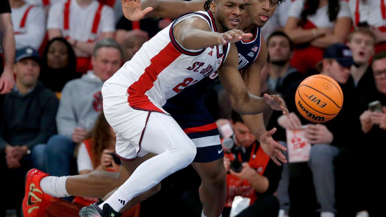 St. John's forward Zuby Ejiofor, left, and UConn center Tarris Reed Jr. battle for the ball during the first half of an NCAA college basketball game Friday, Feb. 6, 2026, in New York.
