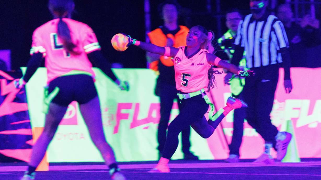 Team Pink's Gigi Torres (5) of Manteca High School, scores a touchdown against Team Green during the Toyota Glow-Up Classic flag football game in San Francisco on Wednesday, Feb. 4, 2026.
