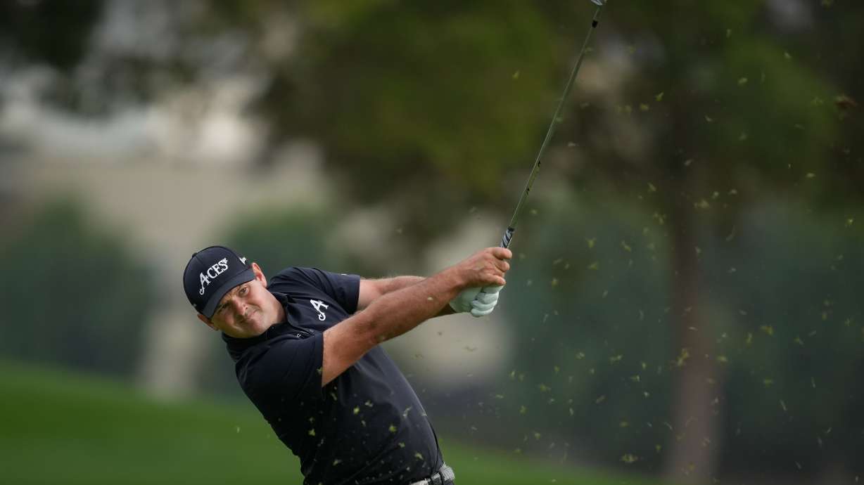 Patrick Reed of the United States plays his second shot on the 18th hole during the final round of the Dubai Desert Classic in United Arab Emirates, Sunday, Jan. 25, 2026.