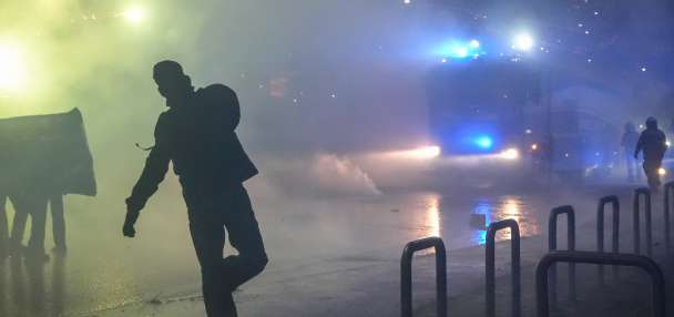 Italian police fire tear gas as protesters clash near Winter Olympics hockey venue