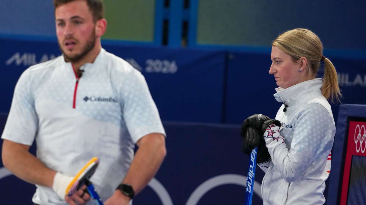 United States' Cory Thiesse and Korey Dropkin look on during the mixed doubles round robin phase of the curling competition against Britain, at the 2026 Winter Olympics, in Cortina d'Ampezzo, Italy, Saturday, Feb. 7, 2026.