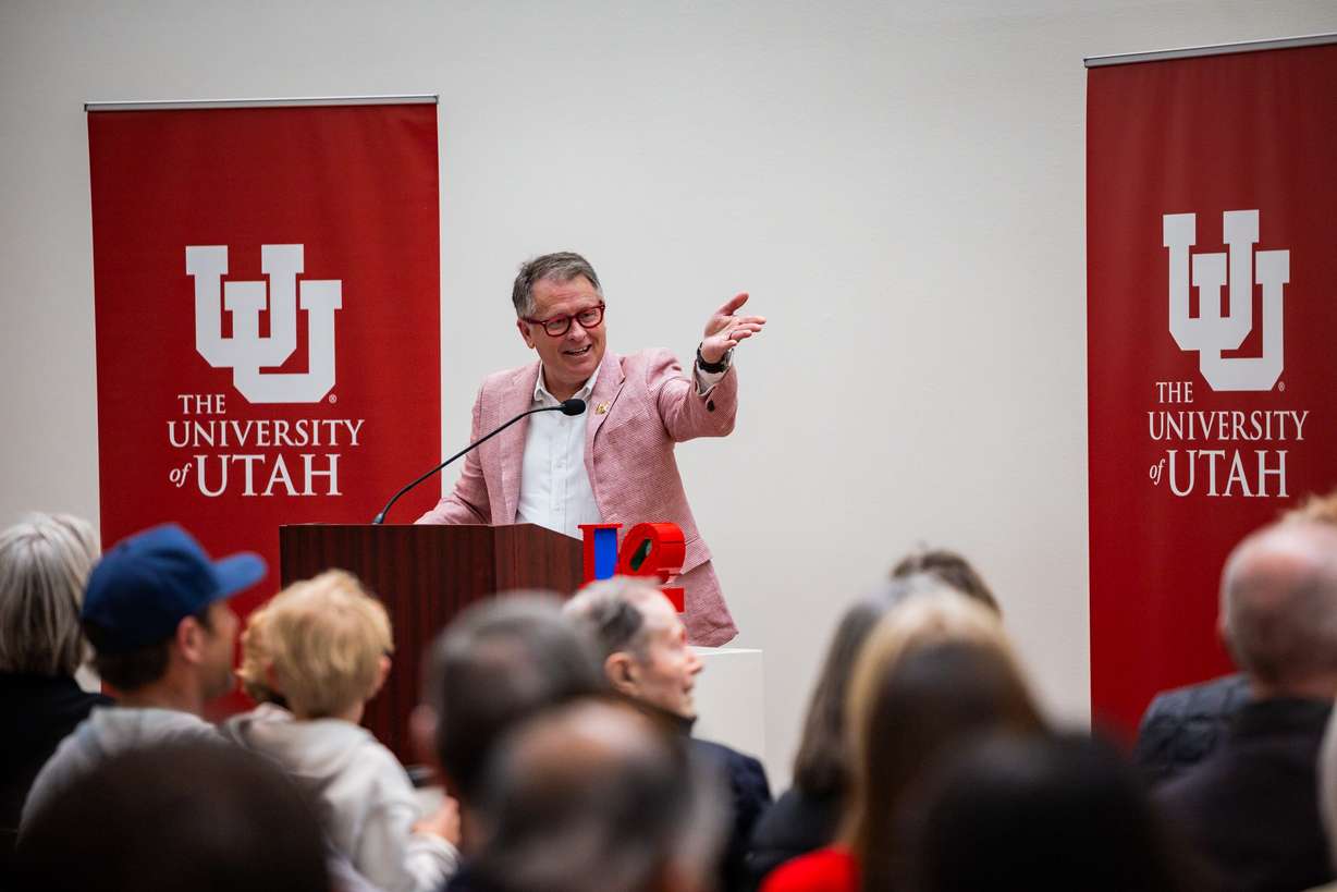 University of Utah president Taylor Randall speaks as people involved in the installation of Robert Indiana's "LOVE" sculpture celebrate inside the Utah Museum of Fine Arts after viewing the sculpture on the south lawn in Salt Lake City on Saturday. The sculpture was installed on the campus earlier this week.