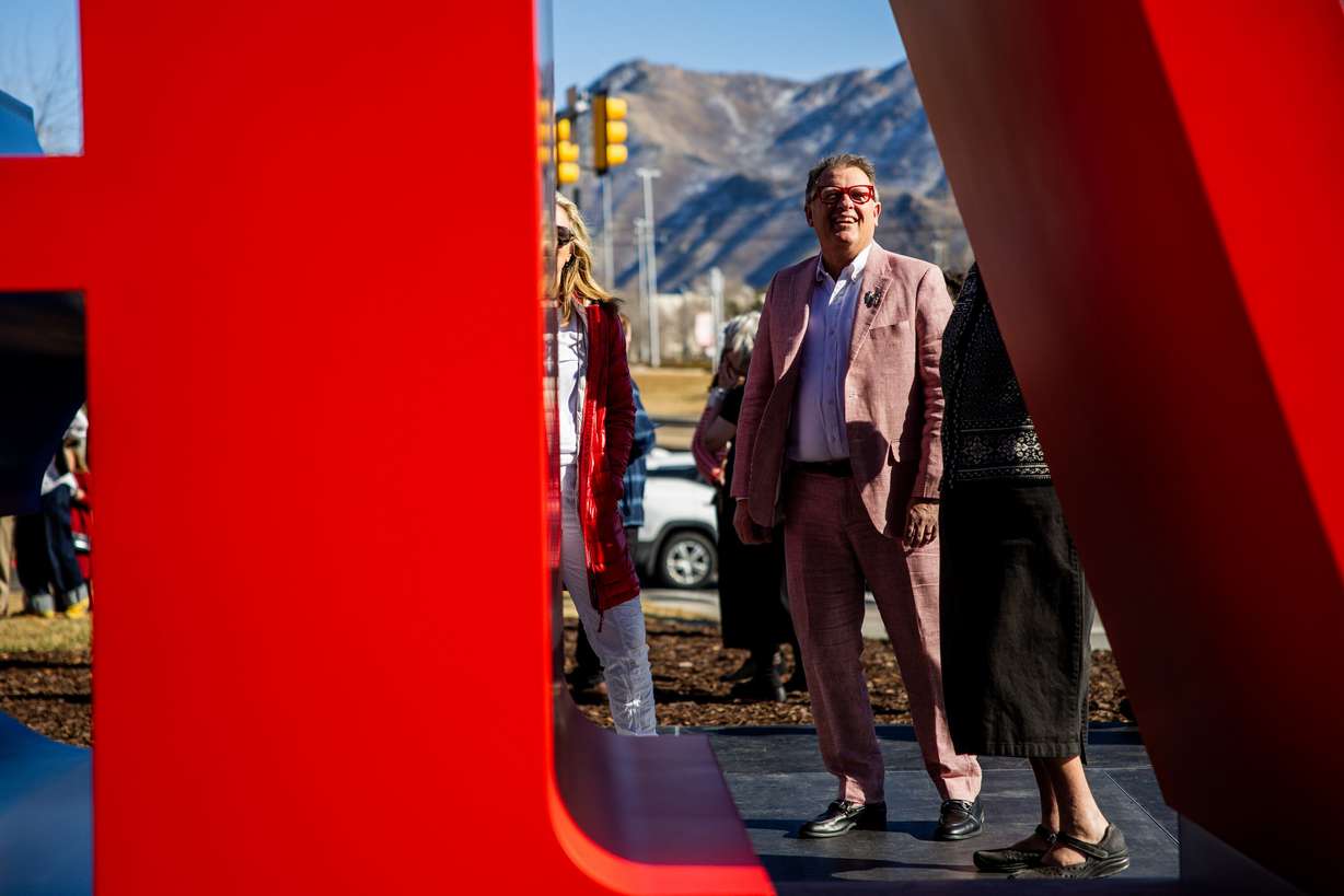 University of Utah president Taylor Randall looks up at Robert Indiana's "LOVE" sculpture on the south lawn of the Utah Museum of Fine Arts in Salt Lake City on Saturday. The sculpture had been acquired with the help of many donations.