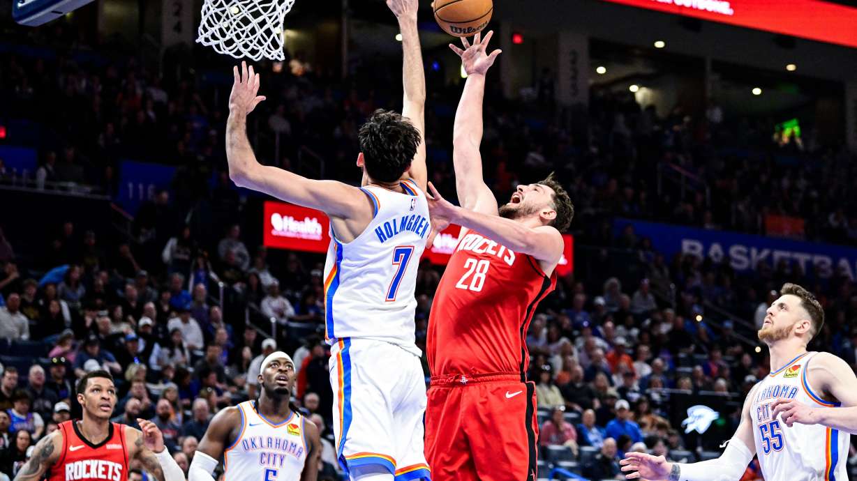 Houston Rockets center Alperen Sengun (28) shoots against Oklahoma City Thunder center/forward Chet Holmgren (7) during the second half of an NBA basketball game Saturday, Feb. 7, 2026, in Oklahoma City.