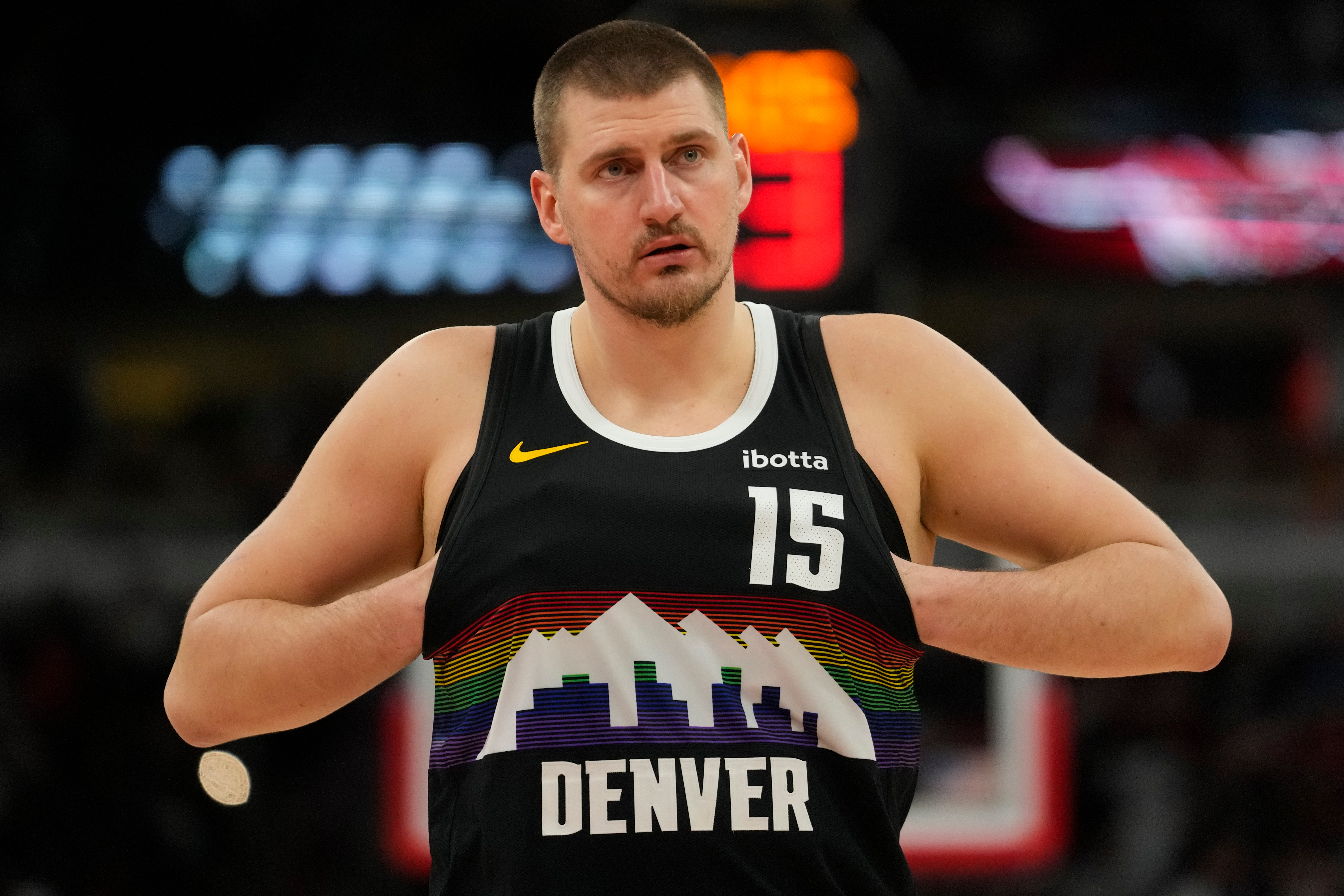 Denver Nuggets center Nikola Jokic (15) sticks his hands in his jersey during the second half of an NBA basketball game against the Chicago Bulls, Saturday, Feb. 7, 2026, in Chicago. 