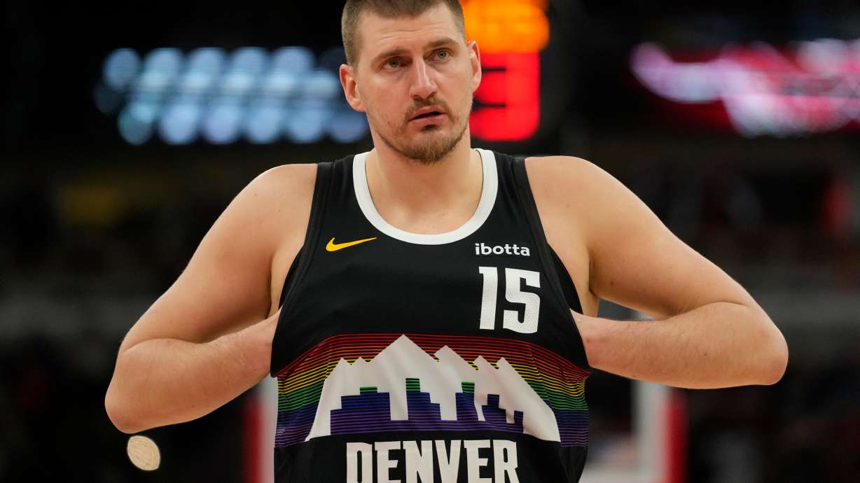 Denver Nuggets center Nikola Jokic (15) sticks his hands in his jersey during the second half of an NBA basketball game against the Chicago Bulls, Saturday, Feb. 7, 2026, in Chicago.