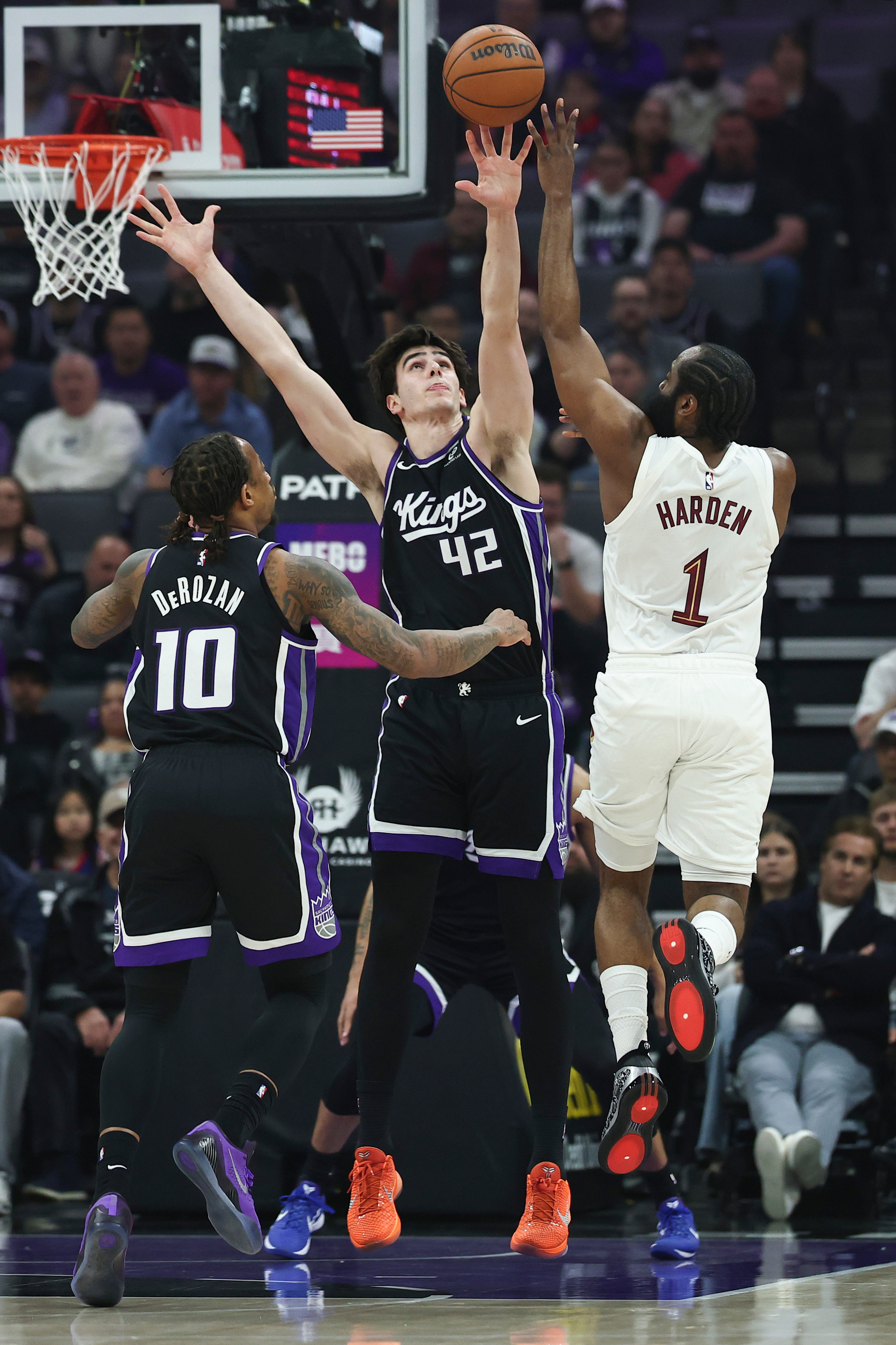Cleveland Cavaliers guard James Harden (1) attempts to pass over Sacramento Kings center Maxime Raynaud (42) during the first half of an NBA basketball game Saturday, Feb. 7, 2026, in Sacramento, Calif. 